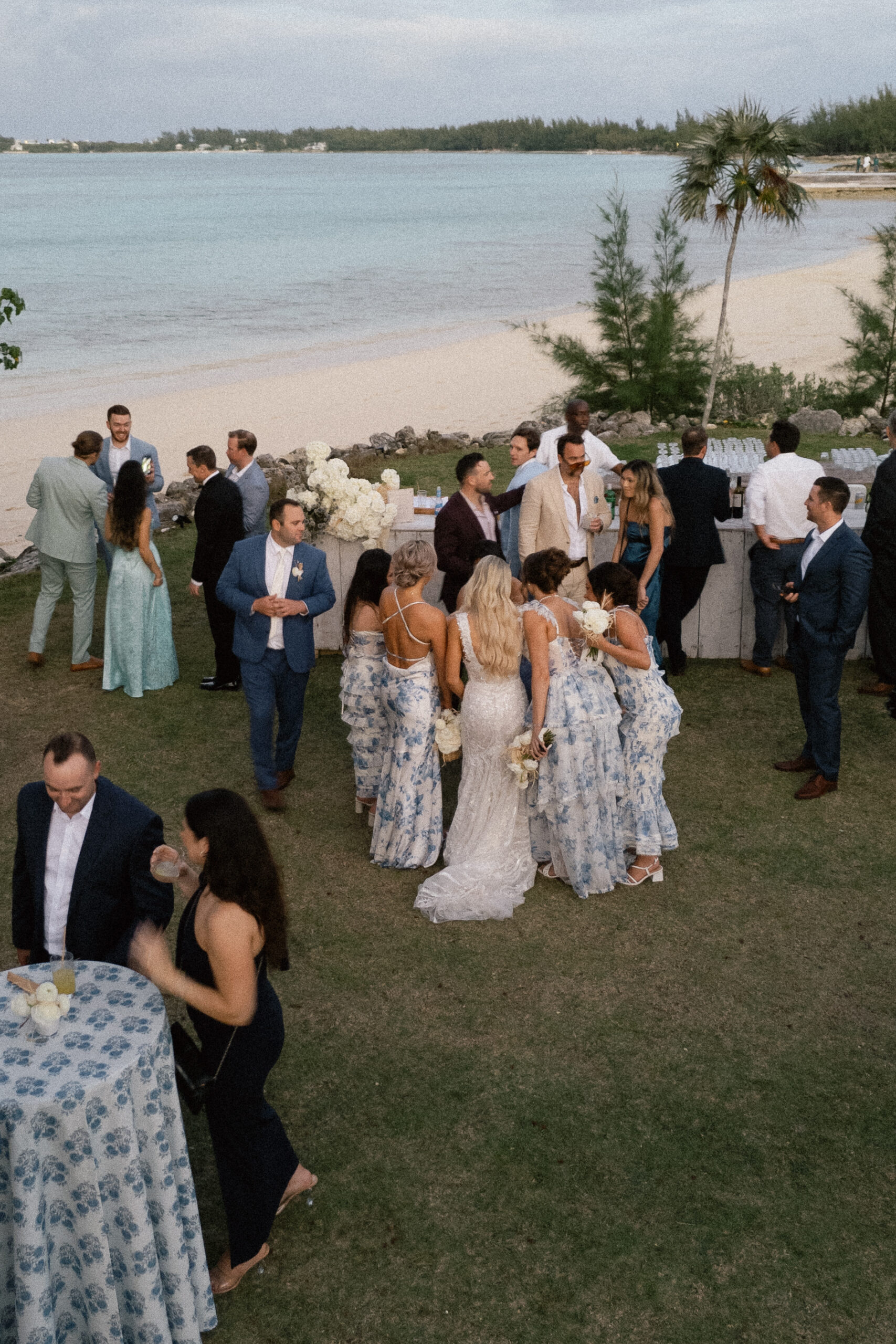 Guests mingling at a modern romantic cocktail hour during The Other Side Eleuthera wedding